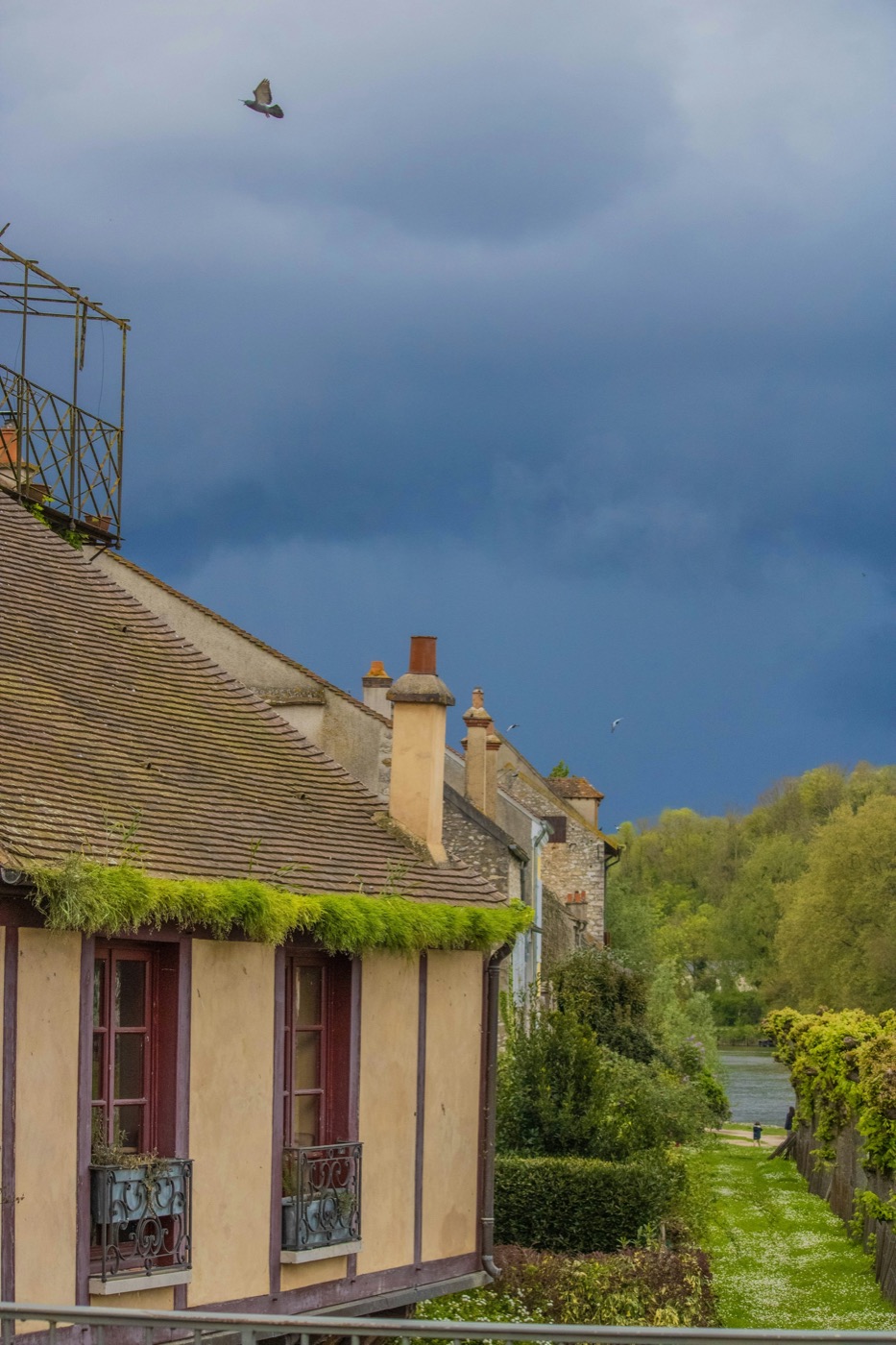 Residential Texas neighborhood beneath dark storm clouds